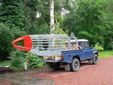 galvanised spitfire sculpture being transported