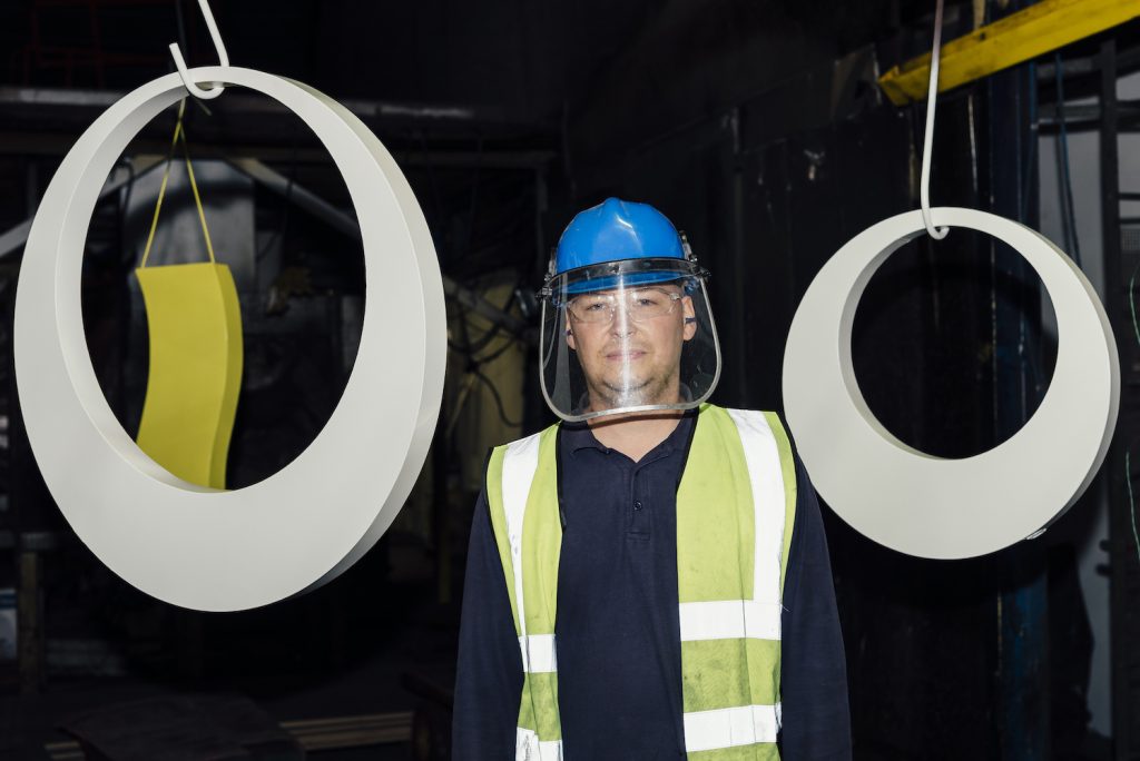 Team member with powder coated circular steel