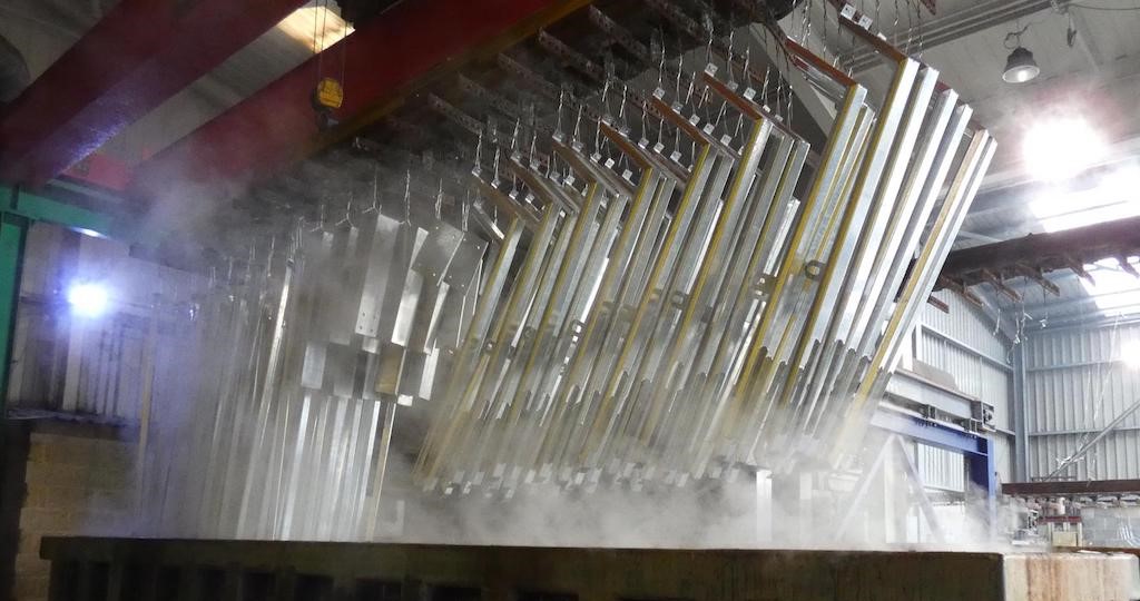 Steel emerging from galvanizing bath