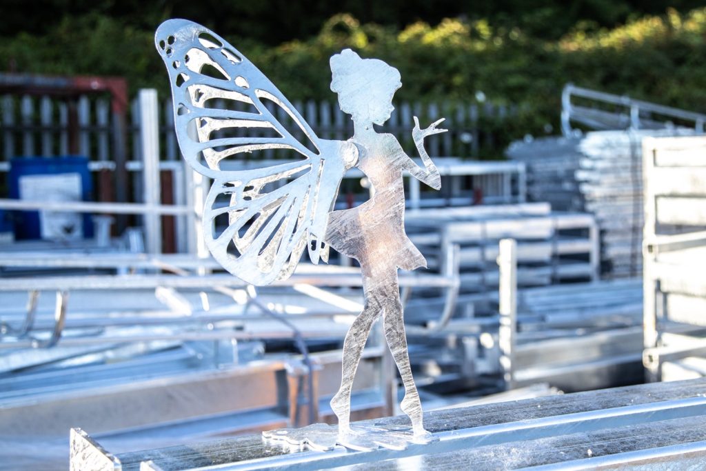 Galvanized fairy sculpture