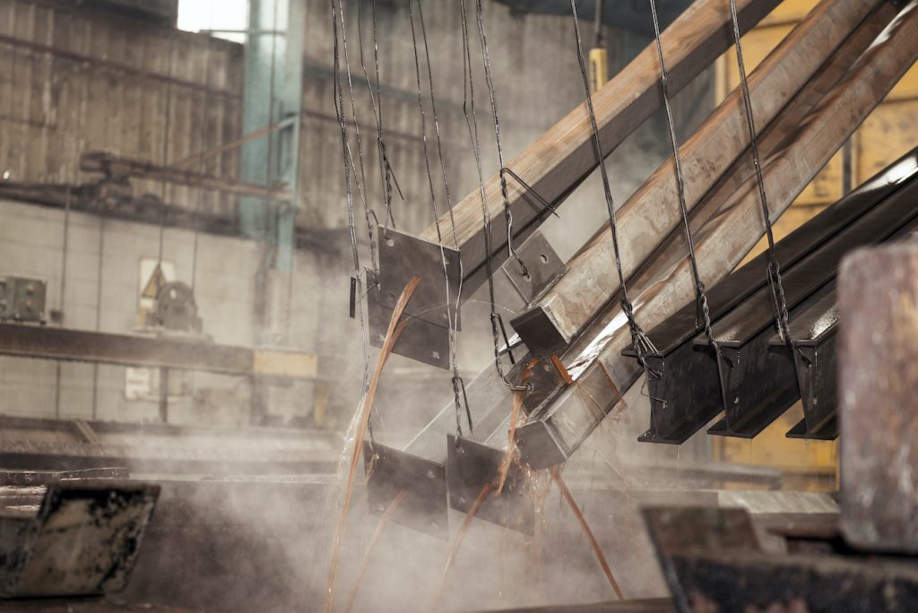 Steel emerging from degreasing bath