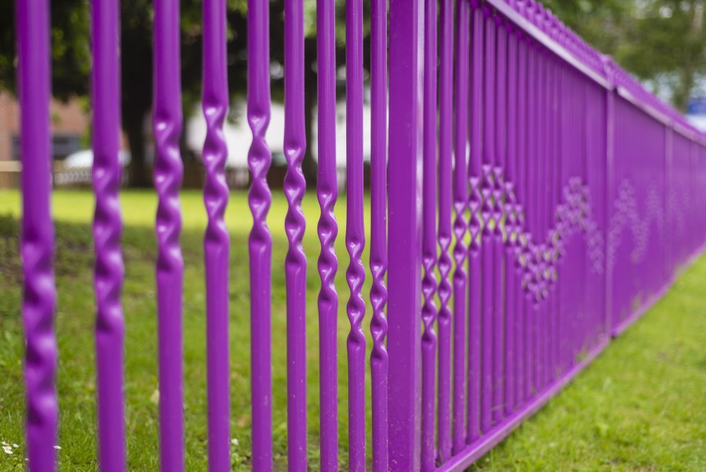 A pink powder coated fence