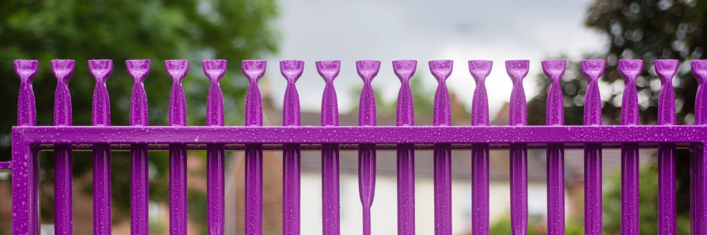 A fence that has been powder coated purple
