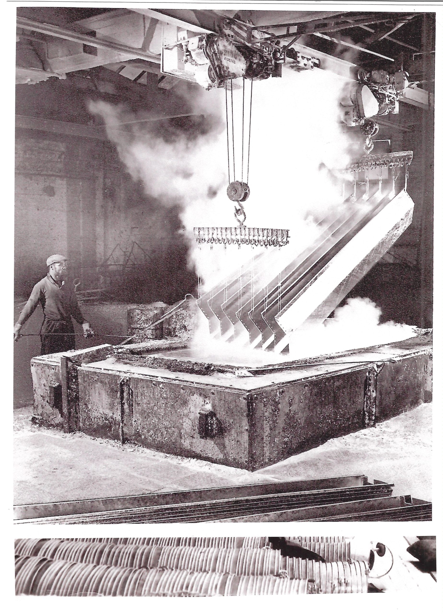 A historical photo of steel being dipped at Joseph Ash Galvanizing